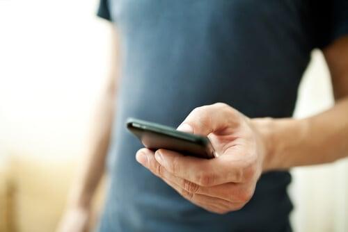 public://2024-09/Man-Holding-Cell-Phone.jpg